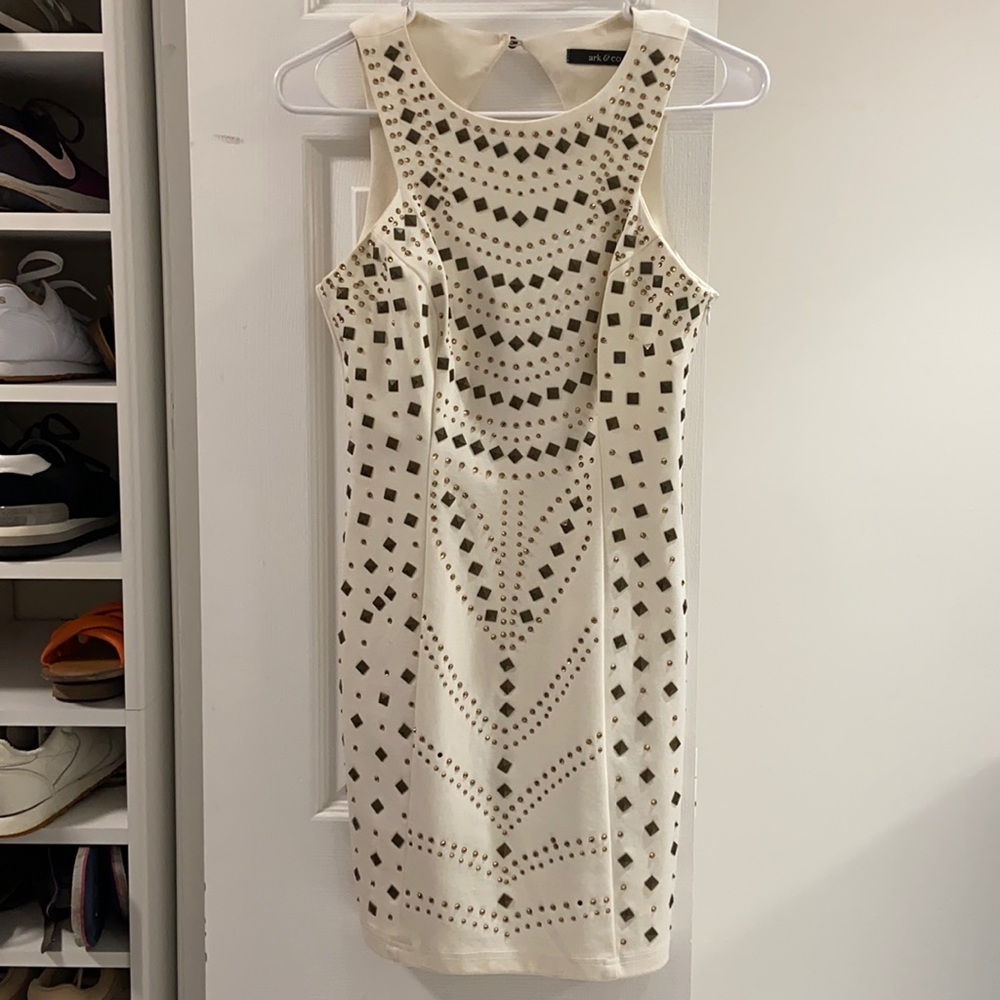 Little white mini dress with metalic details